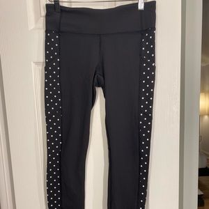 Lululemon low rise leggings. Side details are reflectors.
